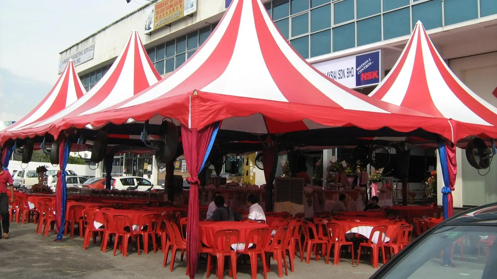 Arabian canopy tent with round tables and chairs set up for an event